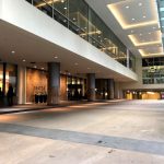 Wide-angle exterior view of Sheraton hotel entrance
