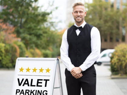 An image of a valet attendant standing at the venue entrance.