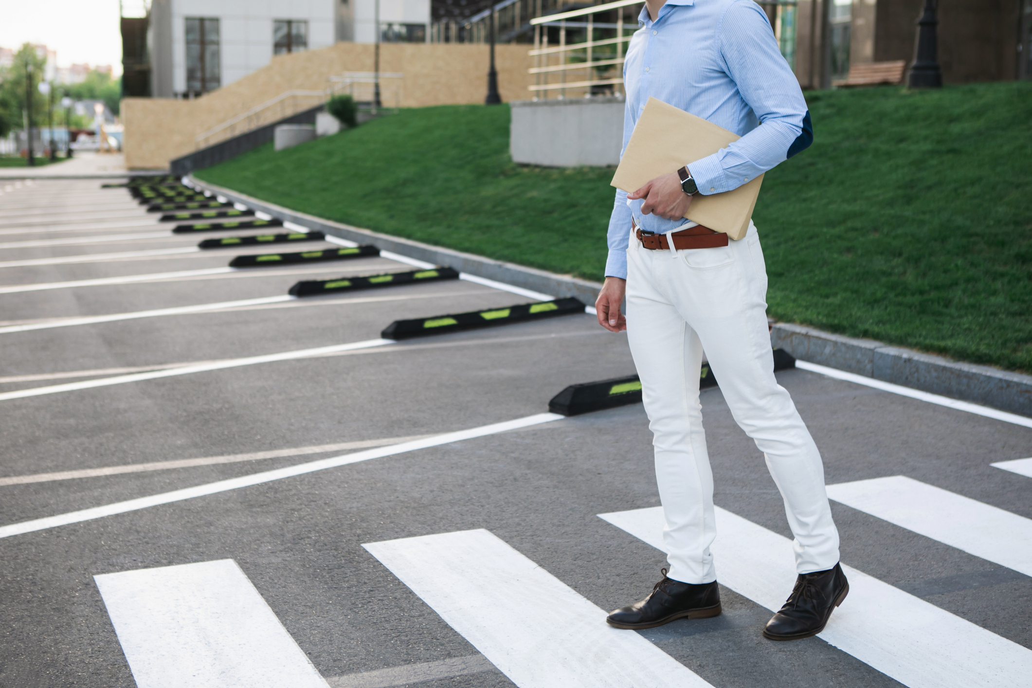 Man in formalwear walking on road