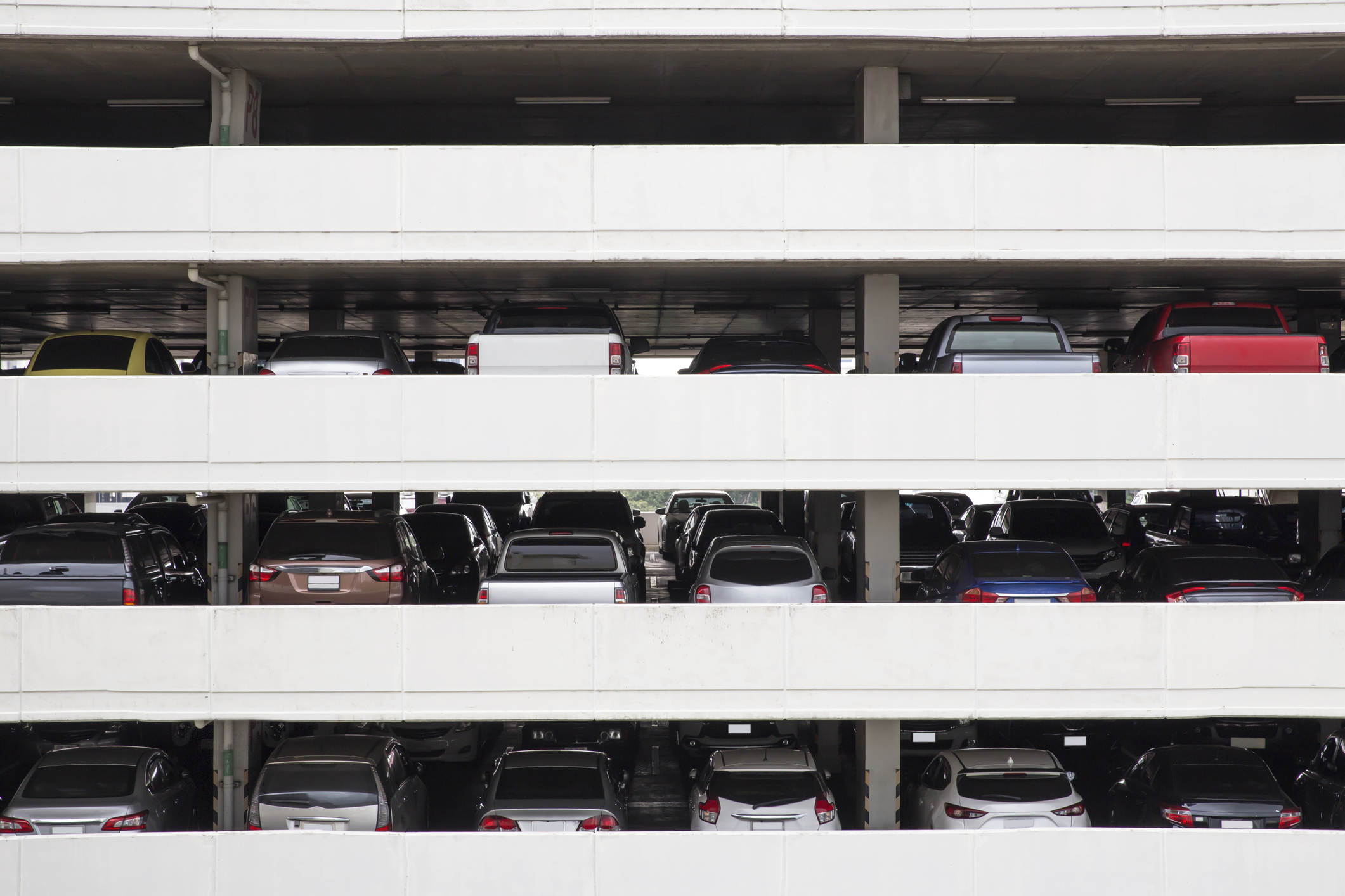 Building Parking Deck Levels and rows in high building in the city .view from the opposite parking garage