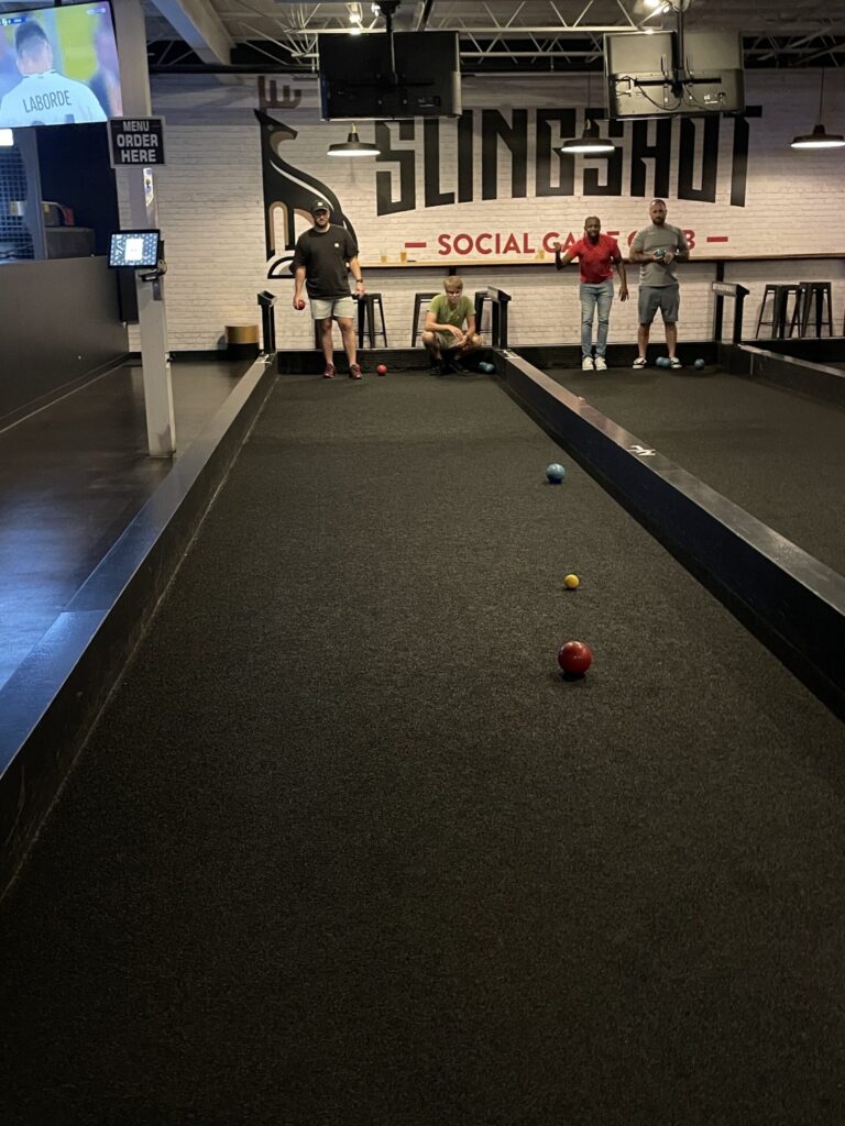 a-group-of-people-playing-bocce-ball-indoors